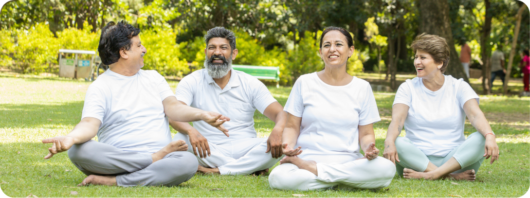 Family doing yoga meditation outdoors in a park